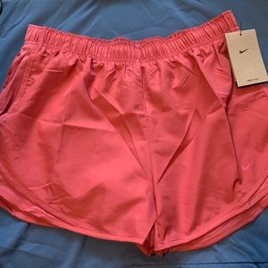 Nike dri-fit salmon colored running shorts with built in underwear